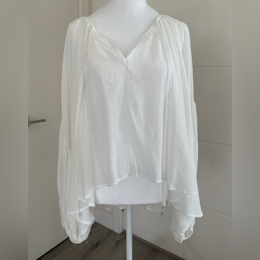 Elegant White Women's Oversized Peasant Crinkle hi-low Top with ballon sleeves .